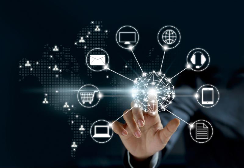 A hand touching a glowing global network with various business icons, symbolizing a comprehensive 360-degree view of market data.
